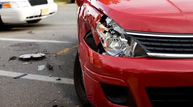 Red Car Involved In Car Crash With Smashed Light