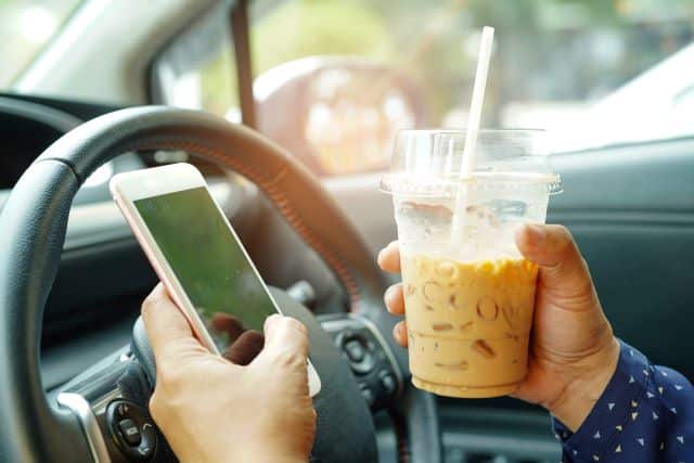 distracted-driving-coffee-phone-while-driving