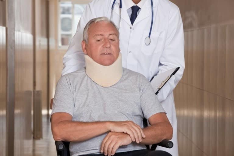 injured-man-wearing-neck-brace-768x512