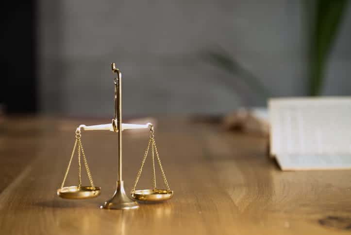 The Scales Of Justice On A Social Security Disability Attorneys Desk
