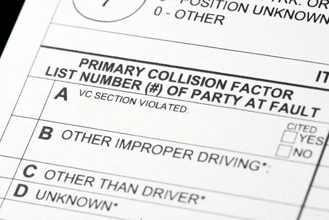 A Close-Up Detail Of A &Quot;Primary Collision Factor&Quot; Section On An Official Form, Listing Options For Determining Fault Such As &Quot;Vc Section Violated,&Quot; &Quot;Other Improper Driving,&Quot; And &Quot;Other Than Driver.
