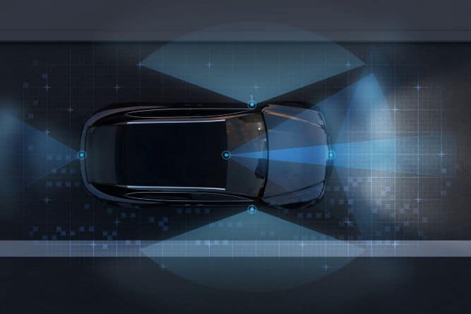 An Overhead View Of A Black Car Illustrating Autonomous Driving Technology With Blue Light Patterns Representing A 360  Sensor And Radar Field Of View.